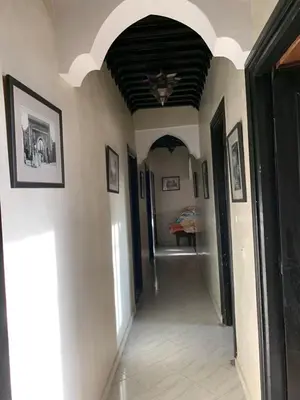 a hallway of a house with an archway at beautiful apartment in Marrakech