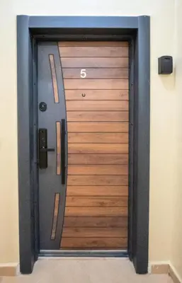 a wooden door with a number on it at Home Lucini To Marrakech in Marrakech