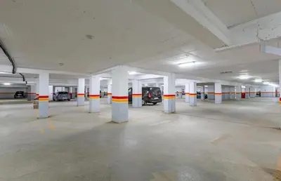 an empty parking garage with columns and cars in it at نور 5 كليز in Marrakech