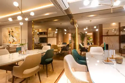 a restaurant with white tables and chairs at Appartement exceptionnel avec golf in Marrakech