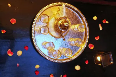 a close up of a gold clock on a table at Diamant La Ville Rouge in Marrakech
