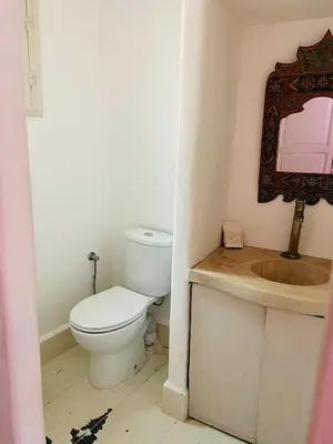 a bathroom with a toilet and a sink at Diamant La Ville Rouge in Marrakech