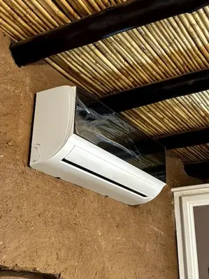 a white object is hanging from a ceiling at 2 Habitaciones en magnifico riad in Marrakech