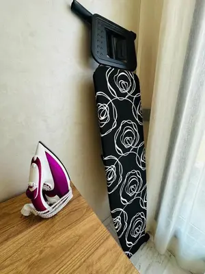 a tie and a pair of shoes sitting on a table at Sompteux Appartement 1 chambre Piscine à Marrakech in Marrakech