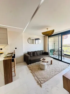 a living room with a couch and a table at Sompteux Appartement 1 chambre Piscine à Marrakech in Marrakech
