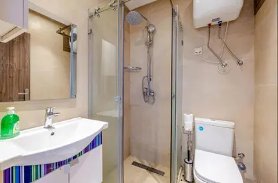 a bathroom with a shower and a sink and a toilet at MARJANA Luxe appartement in Marrakech