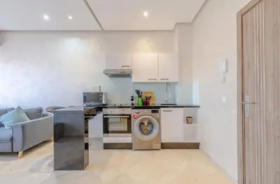 a kitchen with a washing machine in a room at MARJANA Luxe appartement in Marrakech