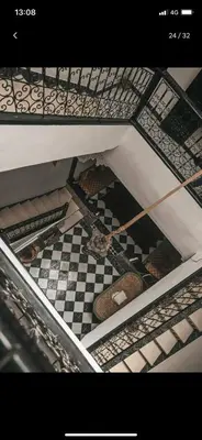 an overhead view of a room with a checkered floor at Tourist Riad in Marrakech