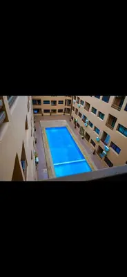 an overhead view of a swimming pool in a building at Love studio in Marrakech