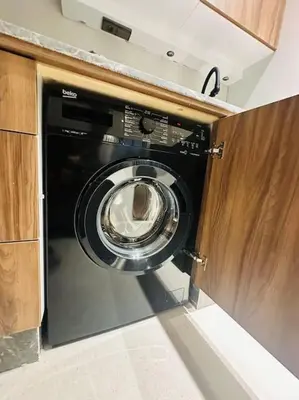 a washer and dryer in a kitchen at Sublime Appartement 1 chambre WIFI à Marrakech in Marrakech