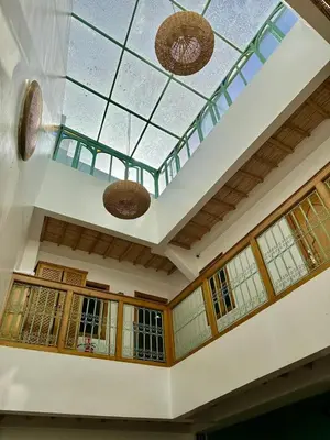 a room with a glass ceiling with windows at Riad Madinina in Marrakech