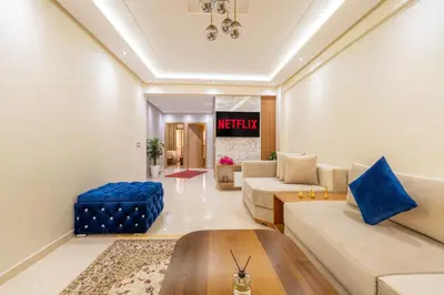 a living room with a couch and a table at L'Havre de paix de Guéliz au Coucher de Soleil in Marrakech