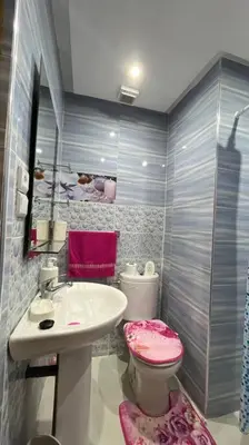 a bathroom with a sink and a toilet at Appartement de luxe en plein centre à Marrakech in Marrakech