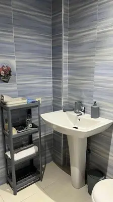 a bathroom with a sink and a toilet at Appartement de luxe en plein centre à Marrakech in Marrakech
