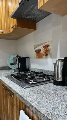 a kitchen with a stove top in a kitchen at Appartement de luxe en plein centre à Marrakech in Marrakech