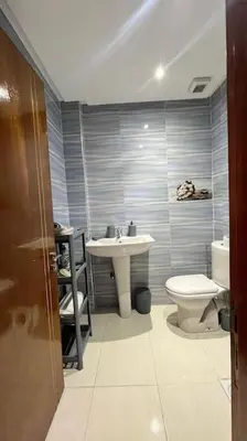 a bathroom with a sink and a toilet at Appartement de luxe en plein centre à Marrakech in Marrakech
