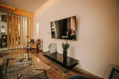 a living room with a table and a couch at Logement confortable et chic, Gueliz, Carre Eden in Marrakech