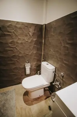 a bathroom with a white toilet in a room at Logement confortable et chic, Gueliz, Carre Eden in Marrakech