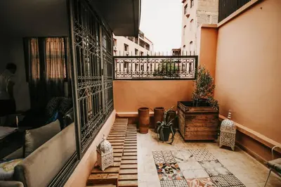 a room with a balcony with a view of a building at Logement confortable et chic, Gueliz, Carre Eden in Marrakech