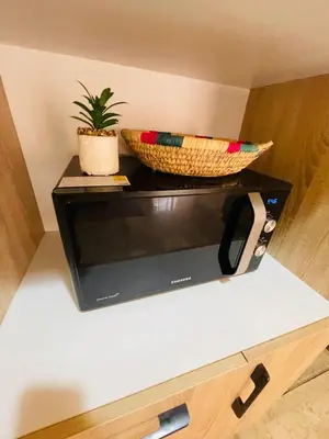 a shelf with two baskets and a plant on it at Super appartement in Marrakech
