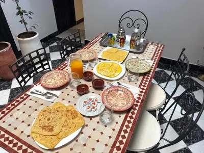 a table with plates of food on top at Riad Dilia in Marrakech