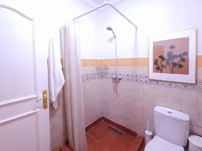 a bathroom with a white toilet and a shower at old a supprimer in Marrakech