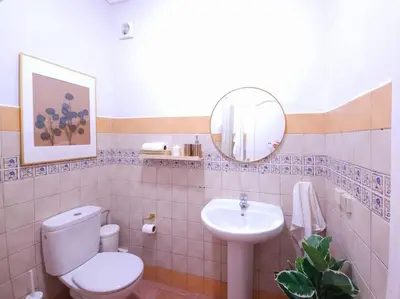 a bathroom with a toilet and a sink and a mirror at old a supprimer in Marrakech