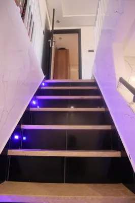 a set of stairs with purple lights on them at Charming Medina Apartment in Marrakech