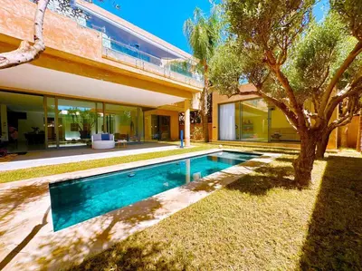 a swimming pool in the backyard of a house at New! Appt de Luxe à Oliver Palm, Piscine Privé in Marrakech