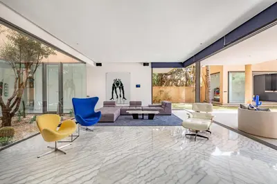 a living room with yellow and blue chairs at New! Appt de Luxe à Oliver Palm, Piscine Privé in Marrakech