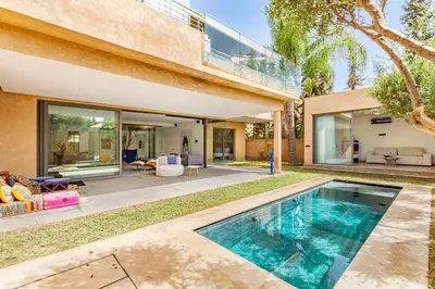 a swimming pool in the backyard of a house at New! Appt de Luxe à Oliver Palm, Piscine Privé in Marrakech