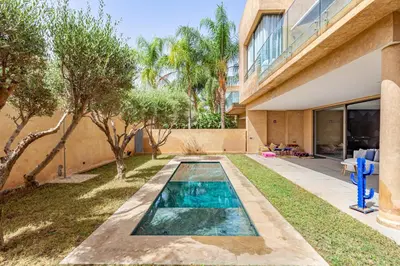 a swimming pool in the backyard of a house at New! Appt de Luxe à Oliver Palm, Piscine Privé in Marrakech