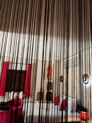 a room with a bed and red and white furniture at Riad shéhérazade Marrakech in Marrakech