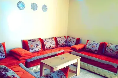 a living room with a couch and a table at Séjour spacieux à Marrakech in Marrakech