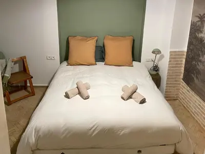 two crosses sitting on top of a bed at Riad Dardeco privé centre Medina Marrakech in Marrakech