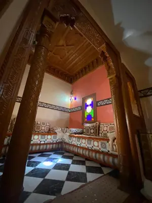 a large room with a checkered floor at Riad Tichka piscine palmeraie in Marrakech