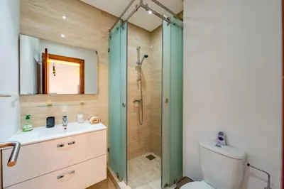 a bathroom with a shower and a toilet and a sink at Relax Front of Pool - Golf- Fiber Optic in Marrakech