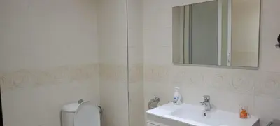 a bathroom with a sink and a toilet and a mirror at dar rita in Marrakech