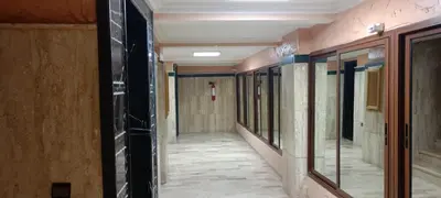 an empty hallway in a building with glass doors at dar rita in Marrakech
