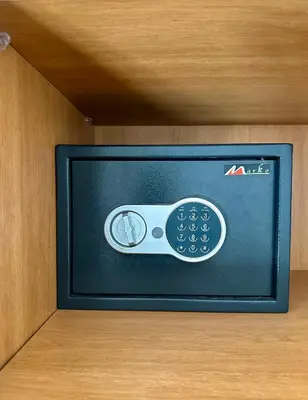a television with a remote control in a cabinet at Appartement 2 chambres perle 24 in Marrakech