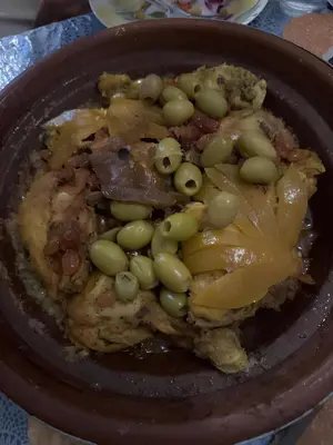 a plate of food with green beans and meat at Dar Coco 180 in Marrakech