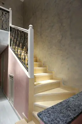 a staircase in a house with a stair railing at Riad Norakech nah zu allen Touristen-Attraktionenr in Marrakech