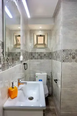 a bathroom with a sink and a shower at Riad Norakech nah zu allen Touristen-Attraktionenr in Marrakech
