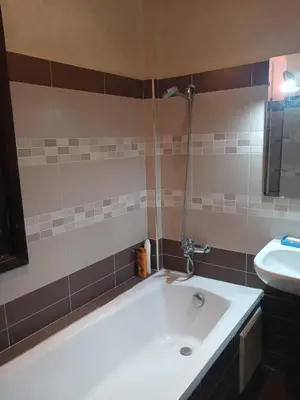 a bathroom with a sink and a bath tub at Villa Lmima Malika in Marrakech