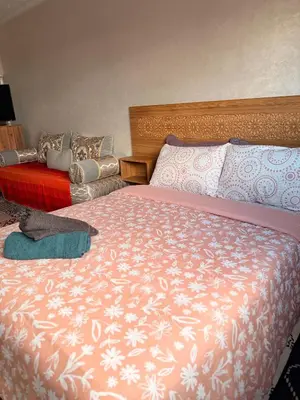 a bedroom with two beds at Julie Airport Marrakech Apartments in Marrakech