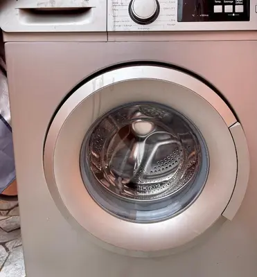 a washer and dryer with a washing machine at Victorious Suites in Marrakech