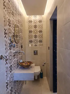 a bathroom with a sink and a toilet at Riad Dar Fatna in Marrakech