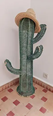 a hat is sitting on top of a green pole at Riad Dar Fatna in Marrakech