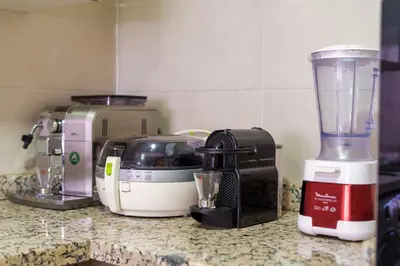 a kitchen counter with a blender and a toaster at 2 Bedrooms Equipped apart in Marrakech