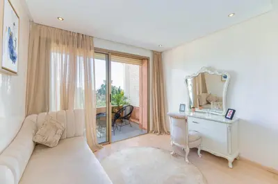 a living room with a white couch and a mirror at 2 Bedrooms Equipped apart in Marrakech